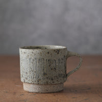 Mostly stacking cup in grey/blue with lines