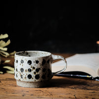 Cup in spotty white