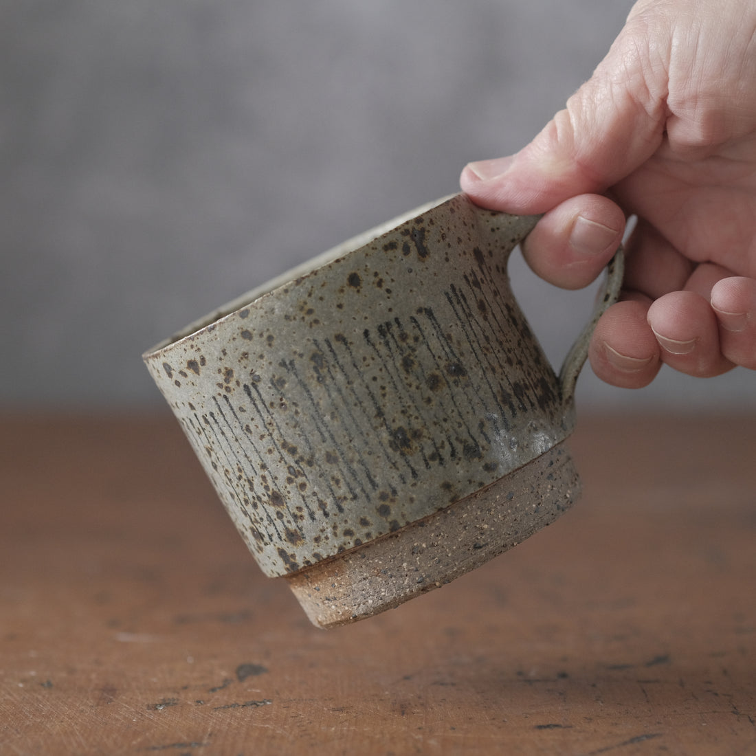 Mostly stacking cup in grey/blue  with lines