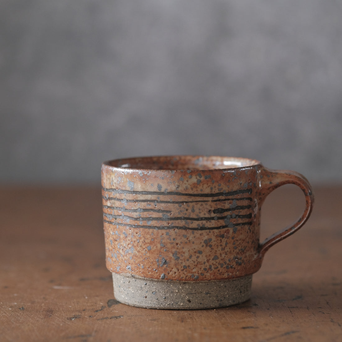 Mostly stacking cup in Shino orange and lines