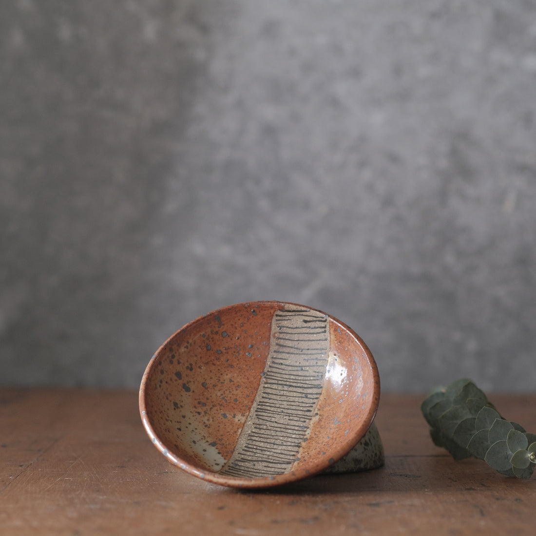Small Dish with lines and shino orange glaze