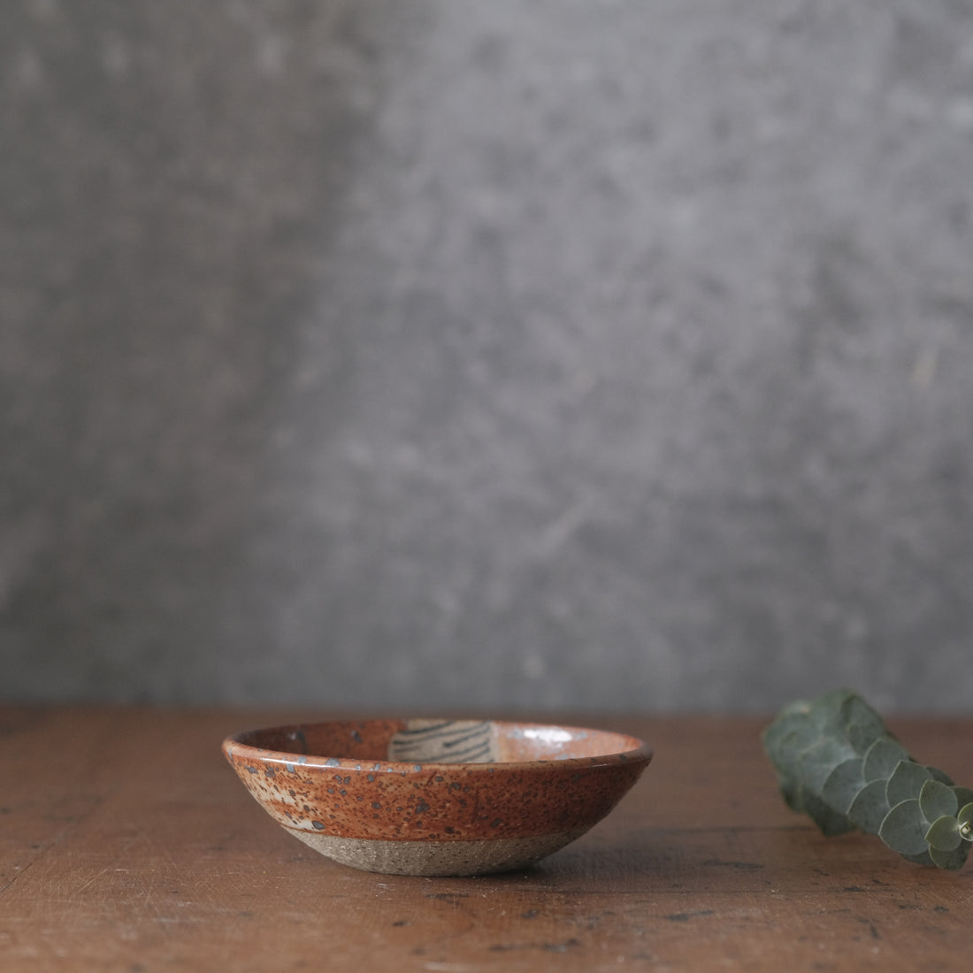 Small Dish with lines and shino orange glaze